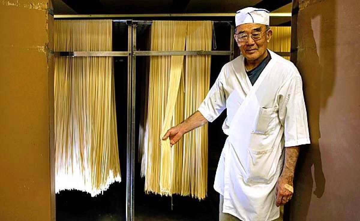 Owner Shoichi Sayano shows off one of his noodle drying closets at Nanka Seimen Noodle Co. in Vernon.