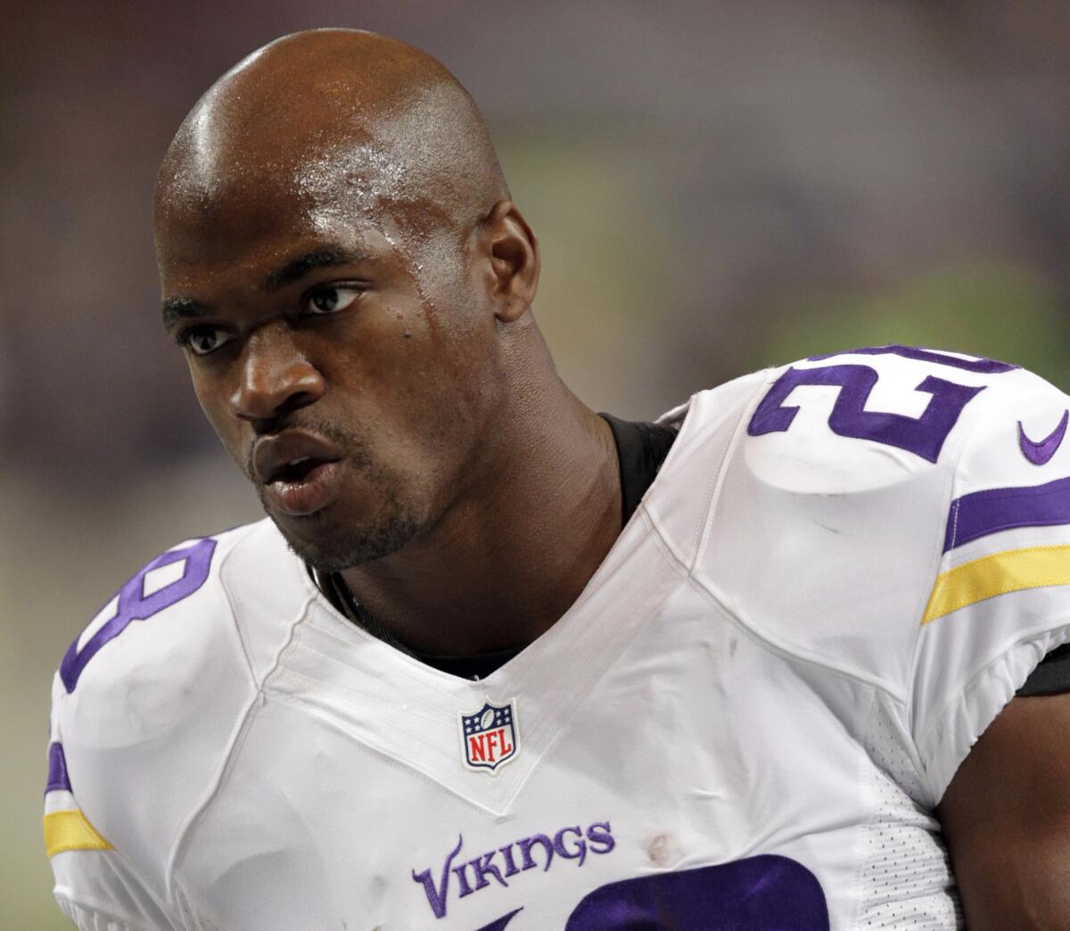 Running back Adrian Peterson warms up for the Minnesota Vikings' game against the St. Louis Rams on Sept. 7.