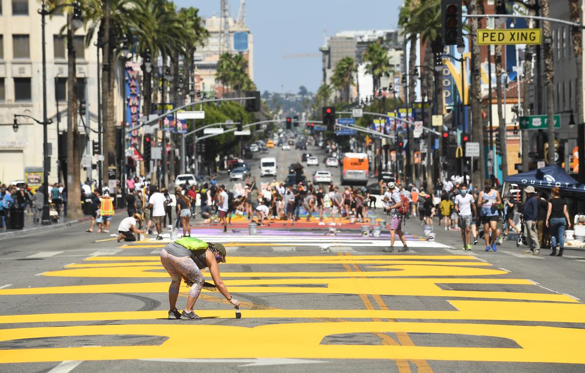 "All Black Lives Matter" is painted on Hollywood Boulevard