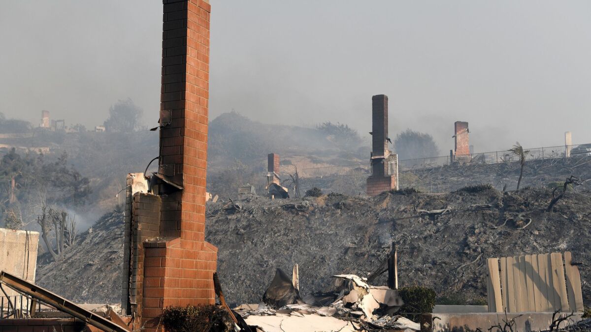Brick chimneys are about all that remain from three Ventura homes burned by the Thomas fire in 2017.