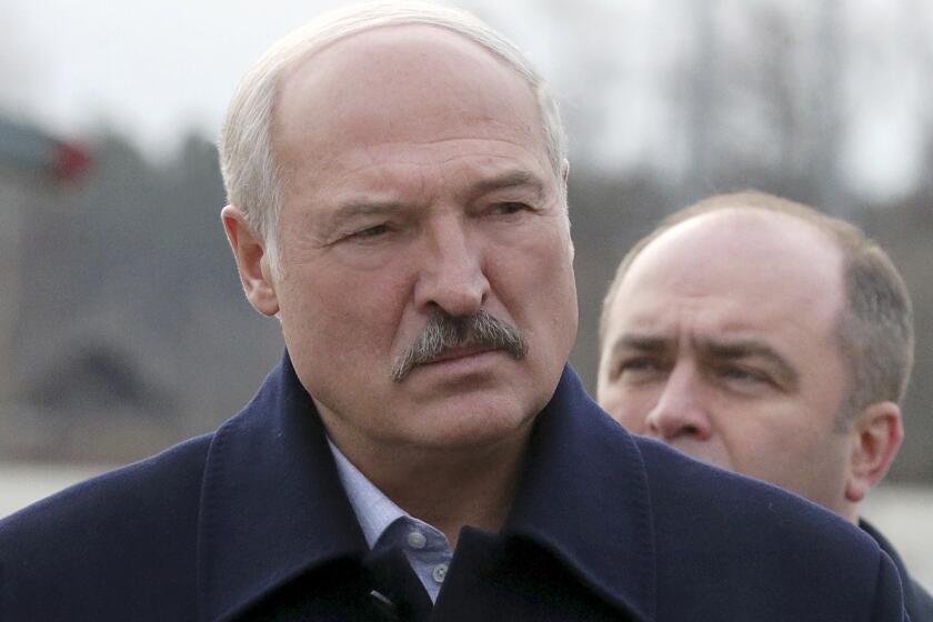 FILE - In this Tuesday, Feb. 4, 2020, file photo, Belarusian President Alexander Lukashenko speaks to journalists as he visits the Dobrush Paper Factory in Dobrush, Belarus. Presidential election in Belarus will take place on Aug. 9, the date that has been set by the country's parliament on Friday, May 8. President Lukashenko, who has ruled the 9.5-million ex-Soviet nation with an iron fist since 1994, announced running for another term last year. If he wins, it will be his sixth consecutive term in office. (Nikolai Petrov/BelTA Pool Photo via AP, File)