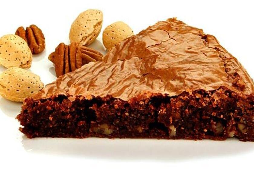 Rich with chocolate flavor. Recipe: Chocolate pecan brownie fudge cake