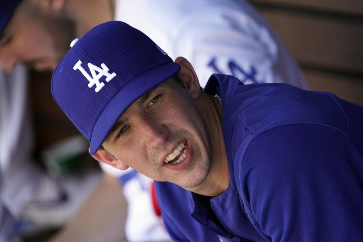 Dodgers pitcher Walker Buehler sits in the dugout during a game against Arizona in May 2022.