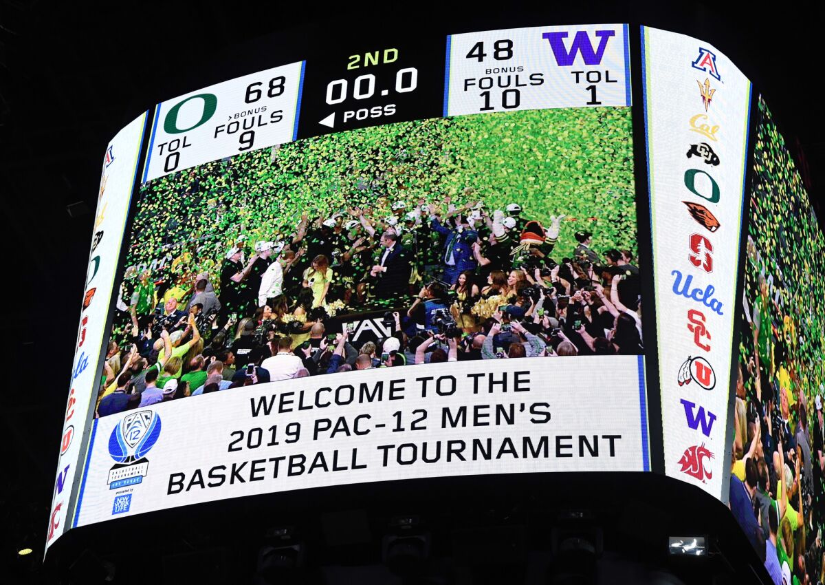 A scoreboard shows the 68-48 final score of the Oregon Ducks' win over the Washington Huskies in the championship game of the Pac-12 basketball tournament at T-Mobile Arena on March 16, 2019 in Las Vegas.