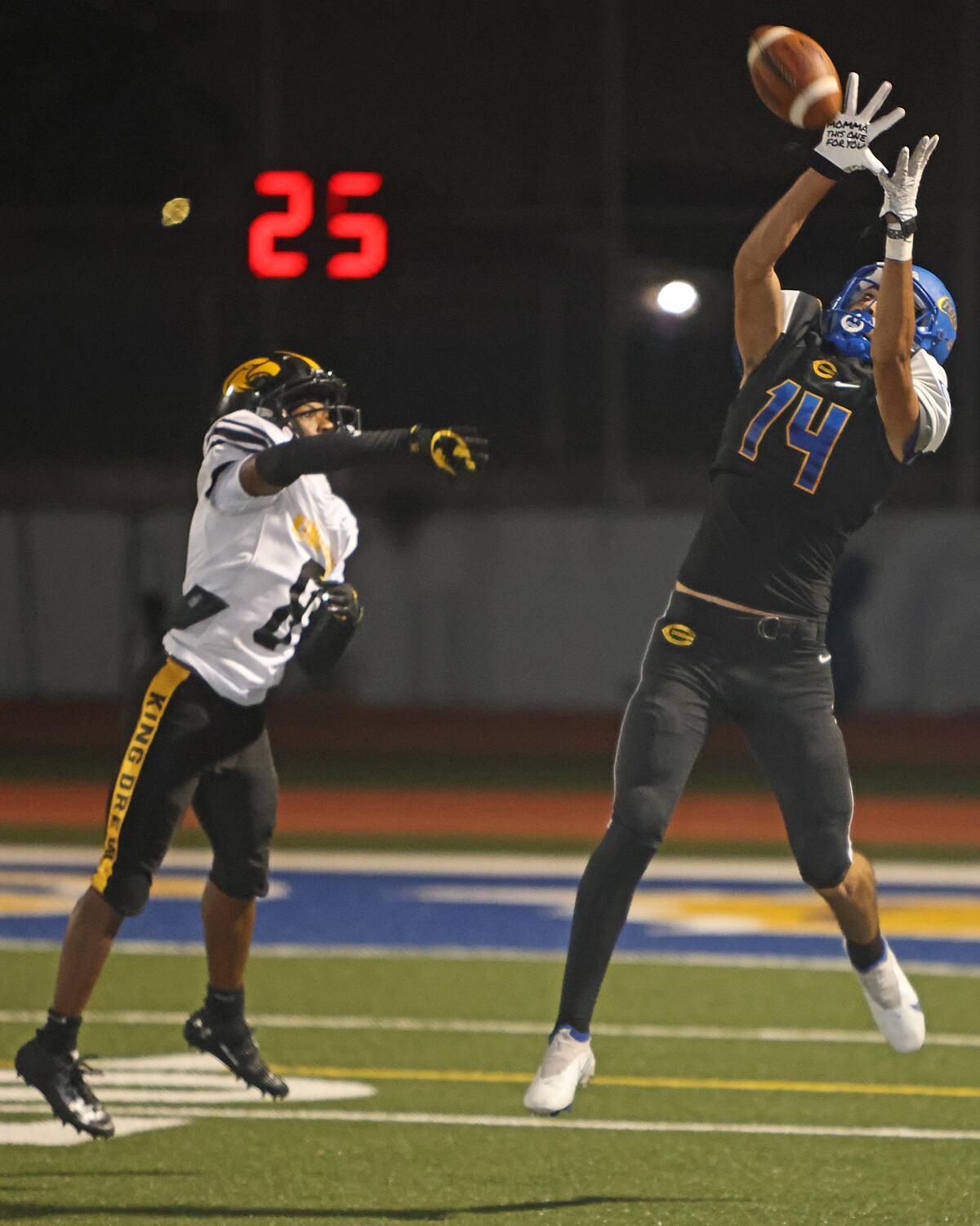 Roberto Salazar of Crenshaw goes up trying to pull down pass during 28-6 win over King/Drew.