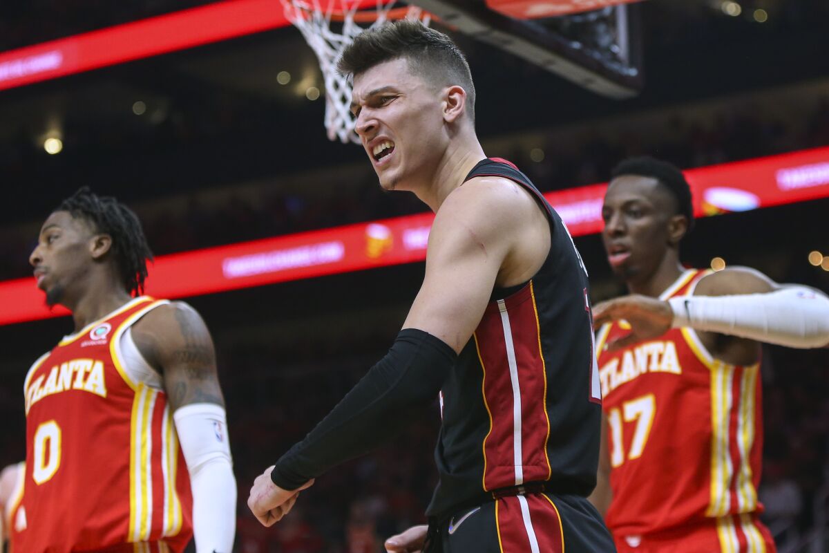 Miami Heat guard Tyler Herro celebrates after a basket during the second half of Game 3 of the team's NBA basketball first-round playoff series against the Atlanta Hawks, Friday, April 22, 2022, in Atlanta. (AP Photo/Brett Davis)