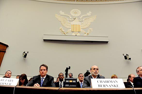 Treasury Secretary Timothy Geithner, left, and Federal Reserve Chairman Ben Bernanke prepare to testify on Capitol Hill in Washington before the House Financial Services Committee.