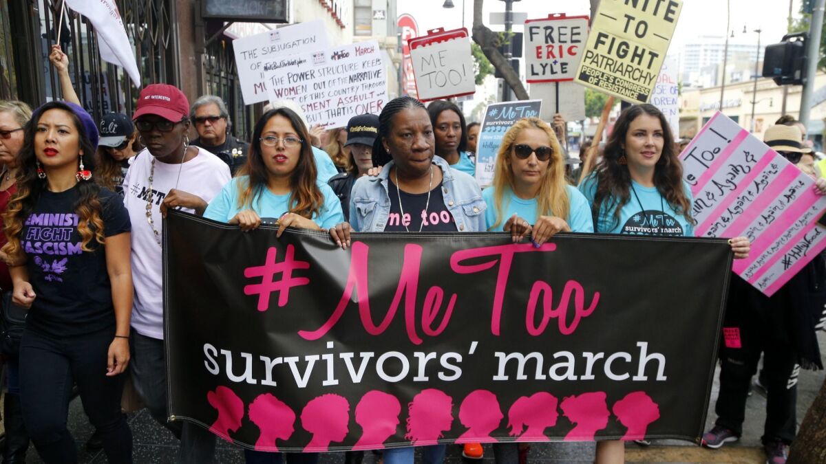Tarana Burke, center, founder of #metoo, at a march in Hollywood on Sunday, Nov. 12, 2017.