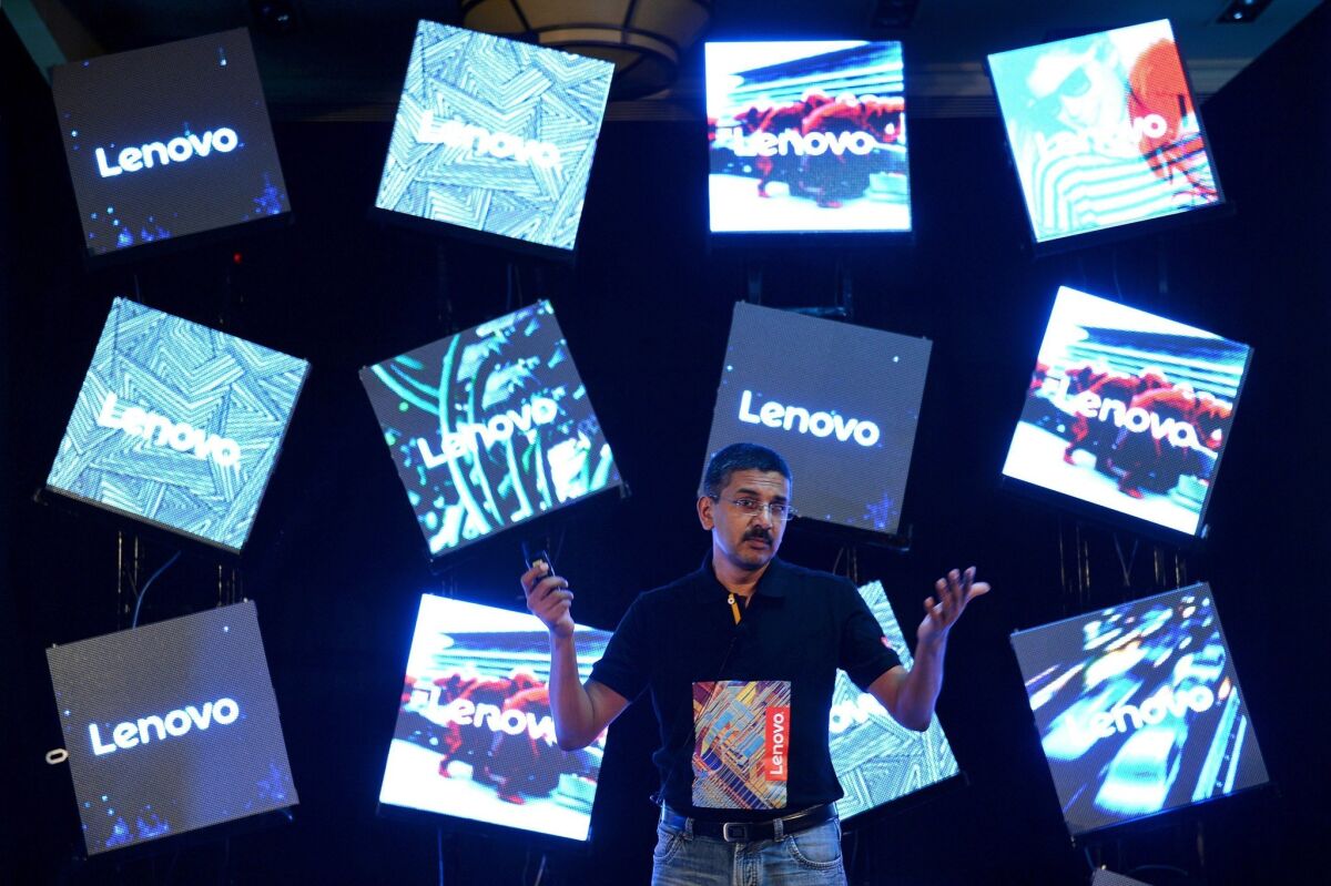 Lenovo India director of sales Ashok Nair discusses Lenovo's line of flexible "Yoga" laptops at its launch in Bangalore, India, on June 9.