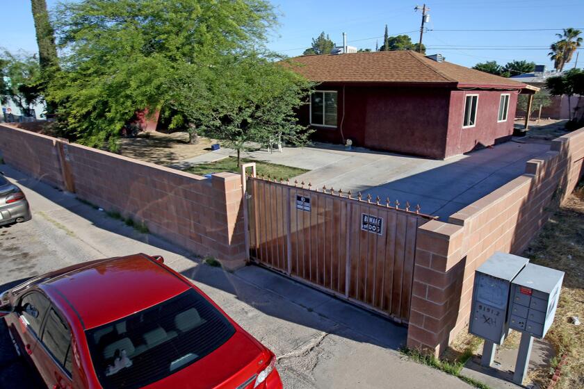 The house on West Calle Medina in Tucson where police say five people died in a murder-suicide.