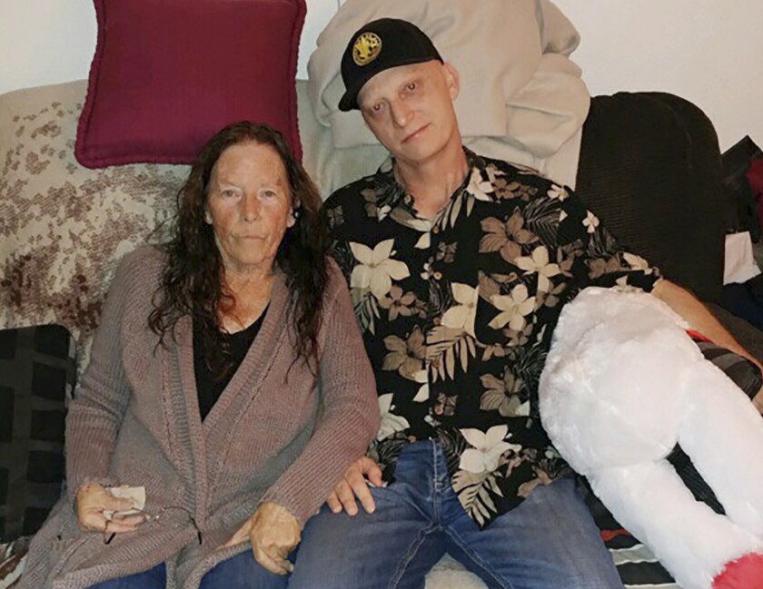 A 2018 file photograph released by lawyer Mark Zaid shows Michael R. White, with his mother, Joanne White. The mother of the U.S. Navy veteran from California sentenced to 10 years in prison by the government of Iran said he has lost his appeal and she is worried that he is being forgotten by the U.S. government.