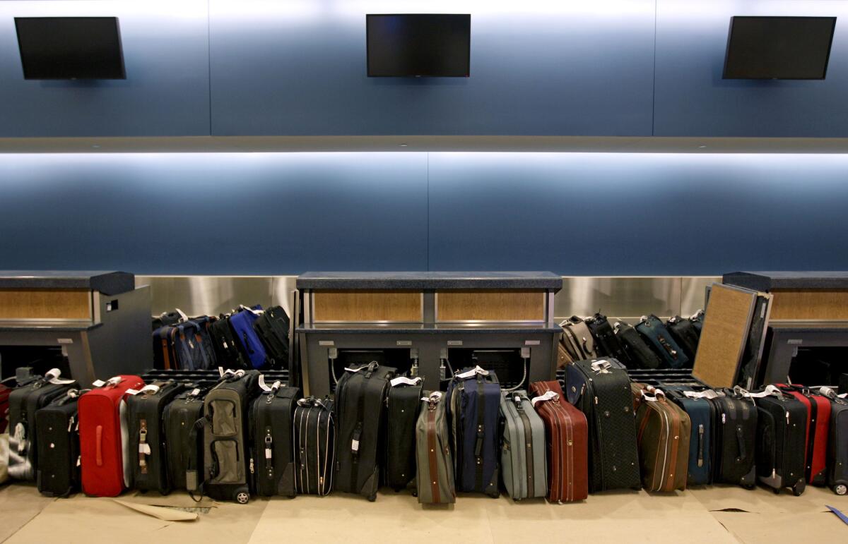 Luggage waits to be run through the baggage system for testing in the Maynard Holbrook Jackson Jr. International Terminal at Atlanta's airport. Revenue from passenger fees are expected to increase 20% this year over last year.