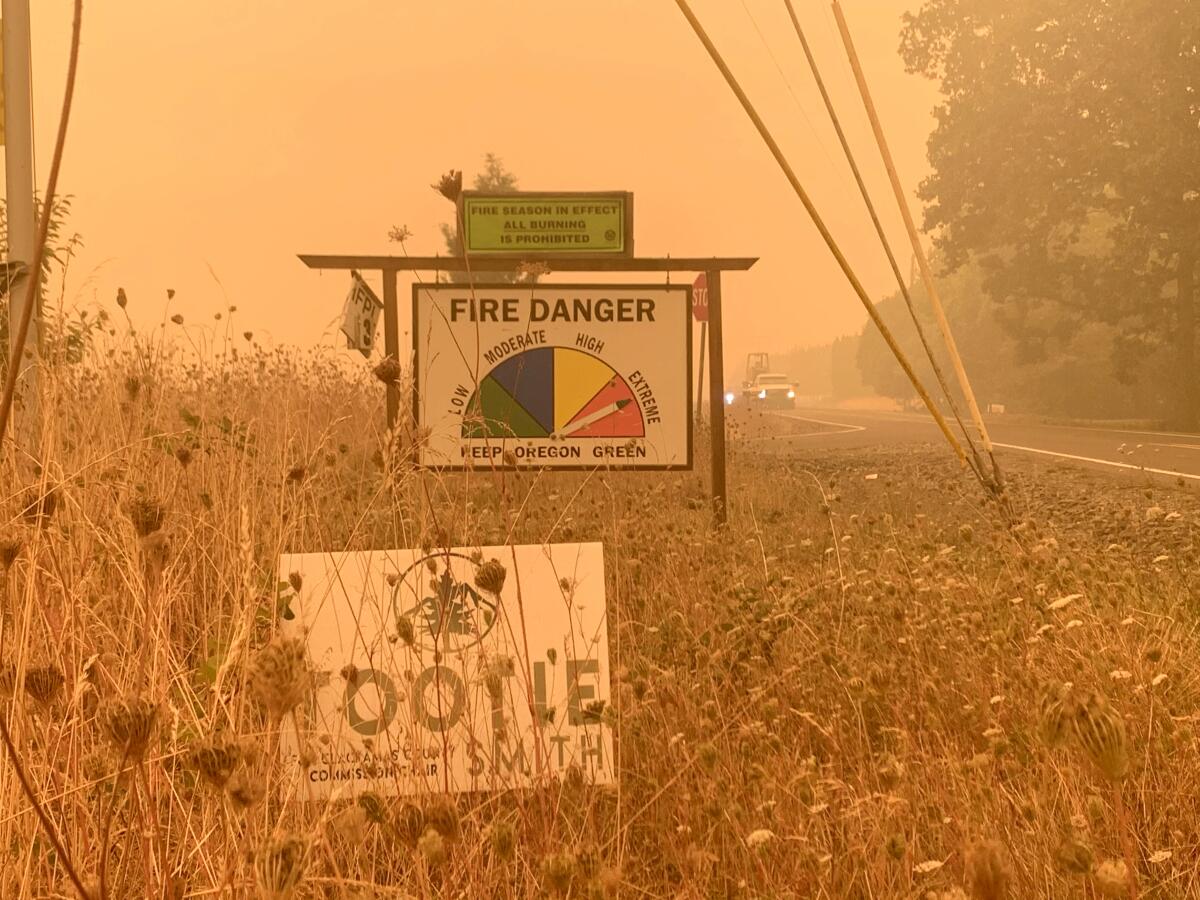 Alissa Azar stopped her car near Molalla, Ore. to take a photograph of this sign when she was confronted by men with guns.