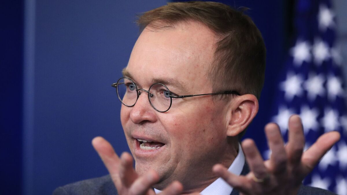 Mick Mulvaney, the acting director of the Consumer Financial Protection Bureau, speaks at a White House news briefing on March 22.