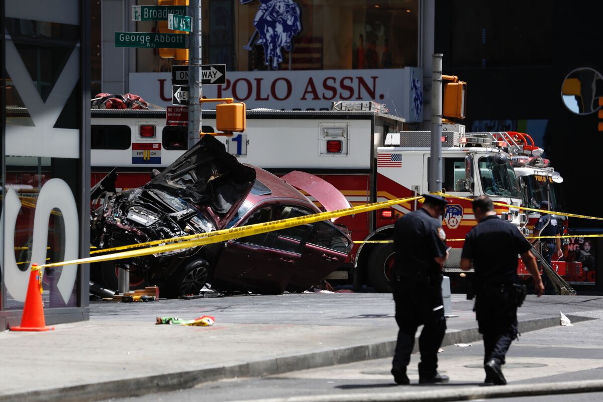 FILE- A smashed car sits on the corner of Broadway and 45th Street in New York's Times Square after several were injured when the car was driven into a crowd of pedestrians on May 18, 2017. Richard Rojas, the man behind the wheel of the car that barreled through crowds of pedestrians in New York City's Times Square, killing a woman and injuring 22 other people, is finally headed to trial, Monday, May 9, 2022, after various delays over five years, including pandemic-induced court shutdowns.(AP Photo/Seth Wenig, File)