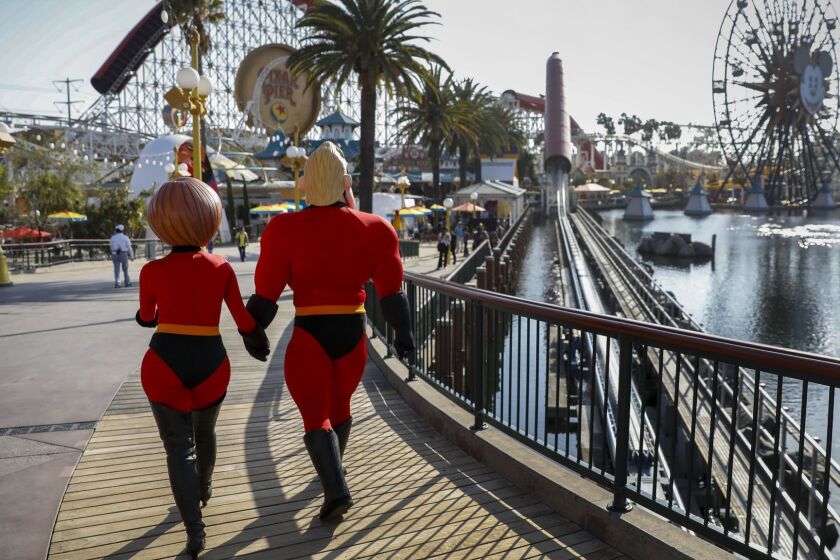 ANAHEIM,CA --THURSDAY, JUNE 21, 2018--Mr. Incredible and Elastigirl, from Pixar's "Incredibles" franchise, during a press preview of Pixar Pier at Disney California Adventure Park, in Anaheim, CA, June 21, 2018. (Jay L. Clendenin / Los Angeles Times)