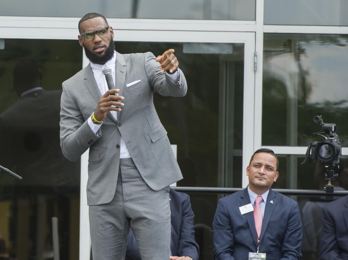 FILE -LeBron James speaks at the opening ceremony for the I Promise School in Akron, Ohio, Monday, July 30, 2018. The I Promise School is supported by the The LeBron James Family Foundation and is run by the Akron Public Schools. LeBron James is soon going to be in the NBA record books as the most prolific scorer ever. But for all his accomplishments on the basketball court, it is James’ ambitious pursuits off-the-court that may ultimately distinguish his legacy from other superstar athletes’.(AP Photo/Phil Long, File)