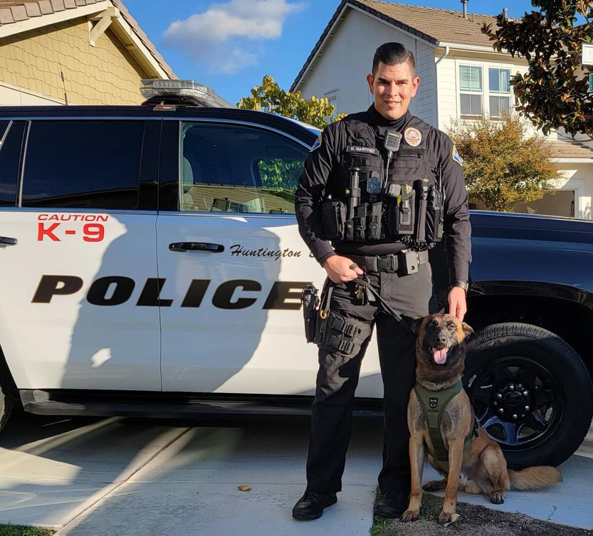 Huntington Beach Police Officer Mitch Martinez poses with his new partner, K9 Aero.