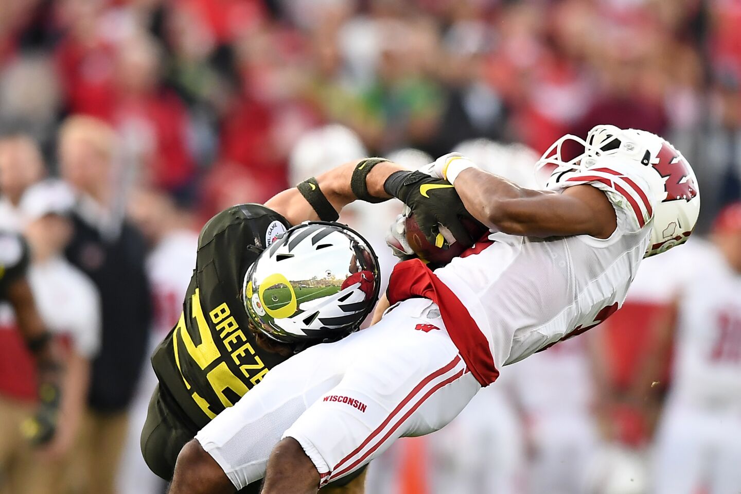 Oregon safety Brady Breeze breaks up a pass intended for Wisconsin receiver Kendric Pryor during the third quarter.