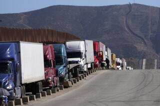 Trucks line up to cross the border into the United States