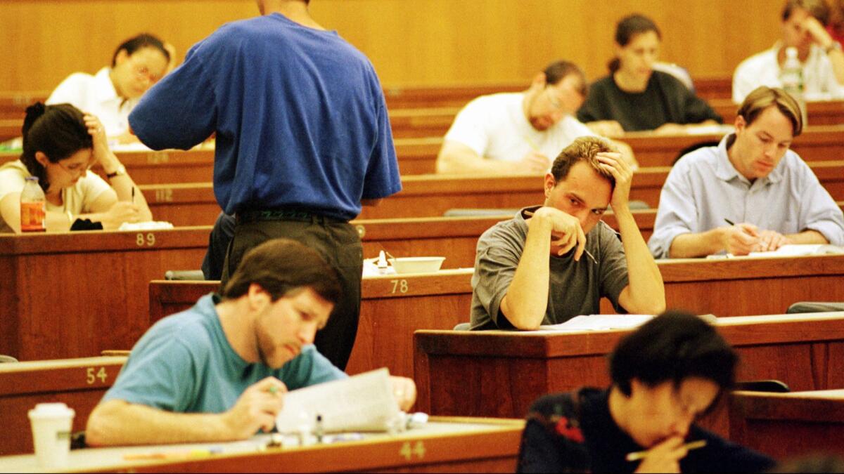 Law students take a practice California state bar exam in a large classroom on the UC Berkeley campus.