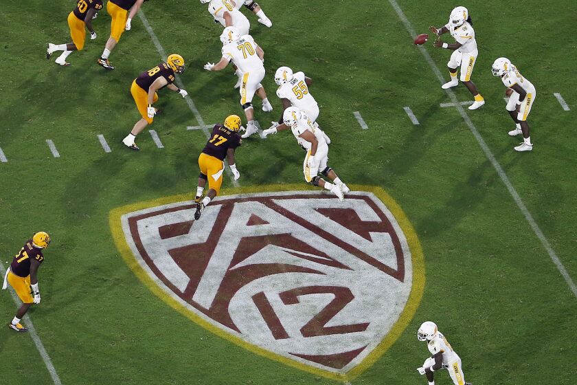 FILE - This Thursday, Aug. 29, 2019, file photo, shows the Pac-12 logo during the second half of an NCAA.
