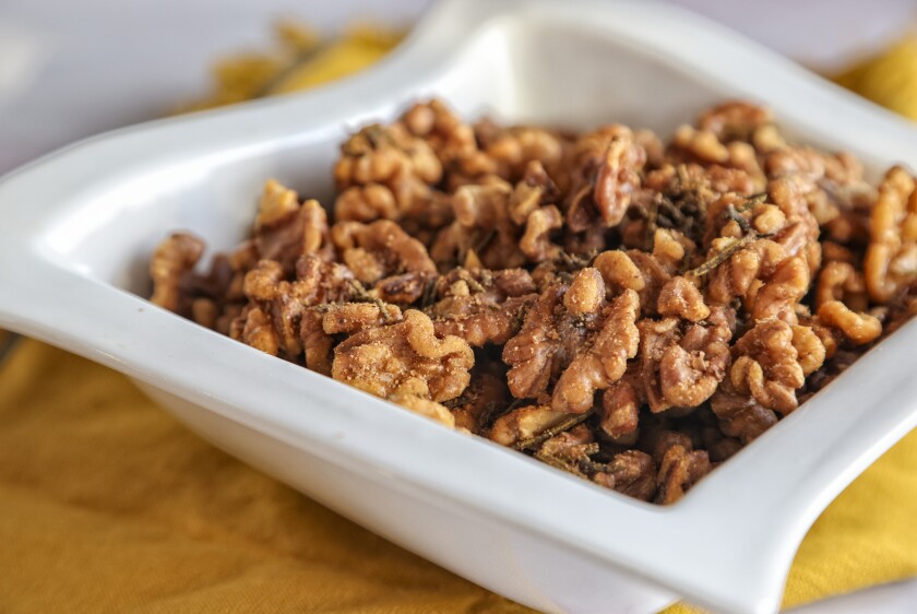 Spiced Walnuts are mixed with rosemary, salt and cayenne or ground red pepper.