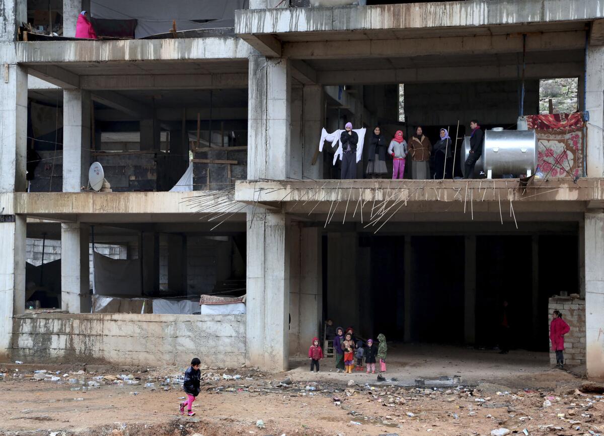Displaced Yazidi families take shelter in a partially constructed building in the northern Iraqi city of Dahuk. In August, Islamic State militants captured Sinjar, sending tens of thousands of Yazidis fleeing for their lives.