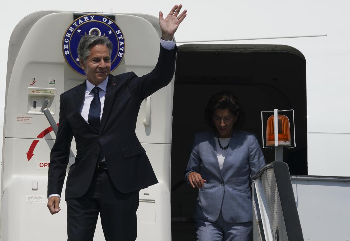 U.S. Secretary of State Antony Blinken waves