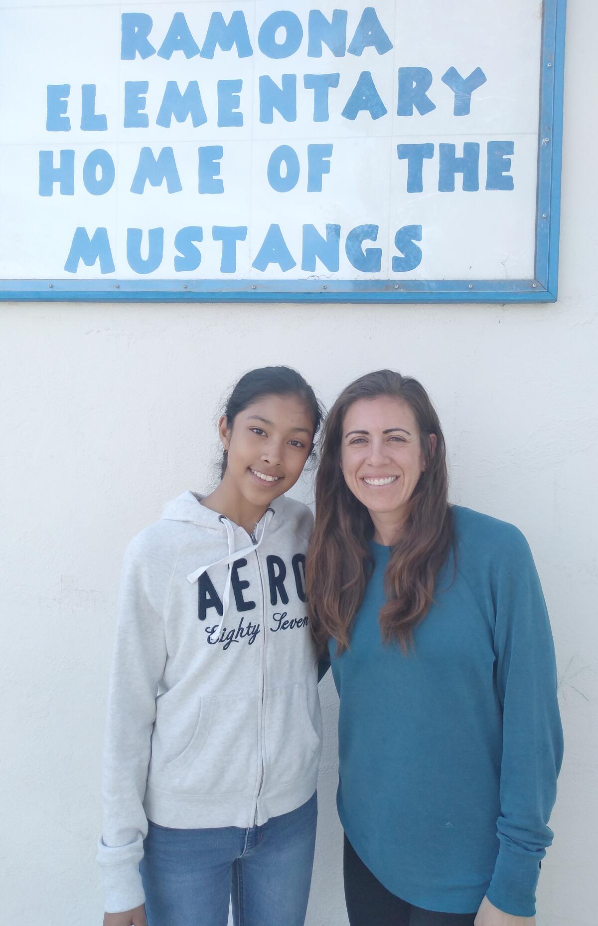 Ramona Elementary School sixth-grader Sherlyn Alvarez-Sanchez, left, recently won a $1,000 Carson Scholars Fund Scholarship. She spent several months applying for the award with help from her teacher Giovanna Roed, right.