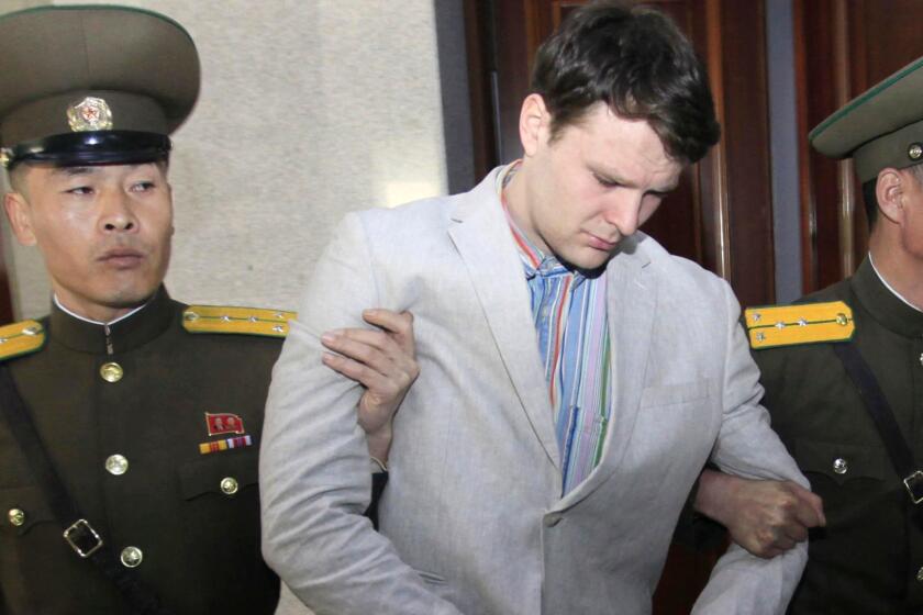 FILE - In this March 16, 2016, file photo, American student Otto Warmbier, center, is escorted at the Supreme Court in Pyongyang, North Korea. Warmbier, an American college student who was released by North Korea in a coma last week after almost a year and a half in captivity, died Monday, June 19, his family said. (AP Photo/Jon Chol Jin, File)