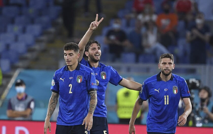 Italy's Manuel Locatelli, center, celebrates with his teammates after scoring his side's second goal during the Euro 2020 soccer championship group A match between Italy and Switzerland at Olympic stadium in Rome, Wednesday, June 16, 2021. (Ettore Ferrari, Pool via AP)