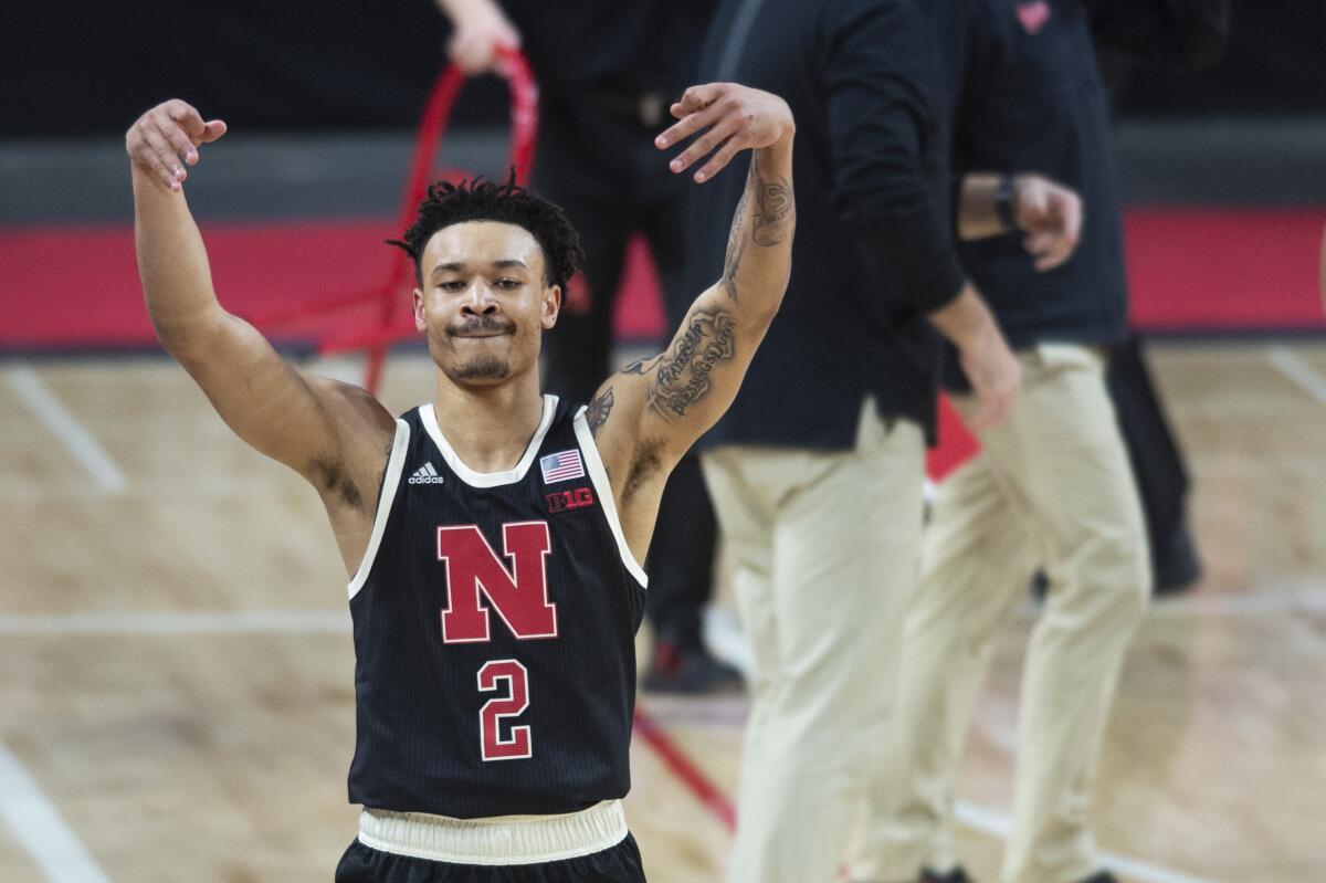 Nebraska's Trey McGowens celebrates a three-point basket he made against Rutgers shortly before a timeout in the second half of an NCAA college basketball game Monday, March 1, 2021, in Lincoln, Neb. (Kenneth Ferriera/Lincoln Journal Star via AP)