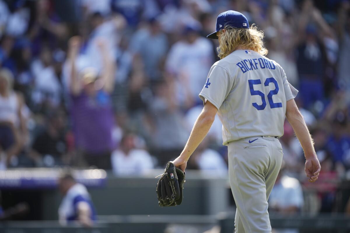 Dodgers reliever Phil Bickford heads to the dugout after giving up a walkoff home run to Colorado’s Charlie Blackmon.