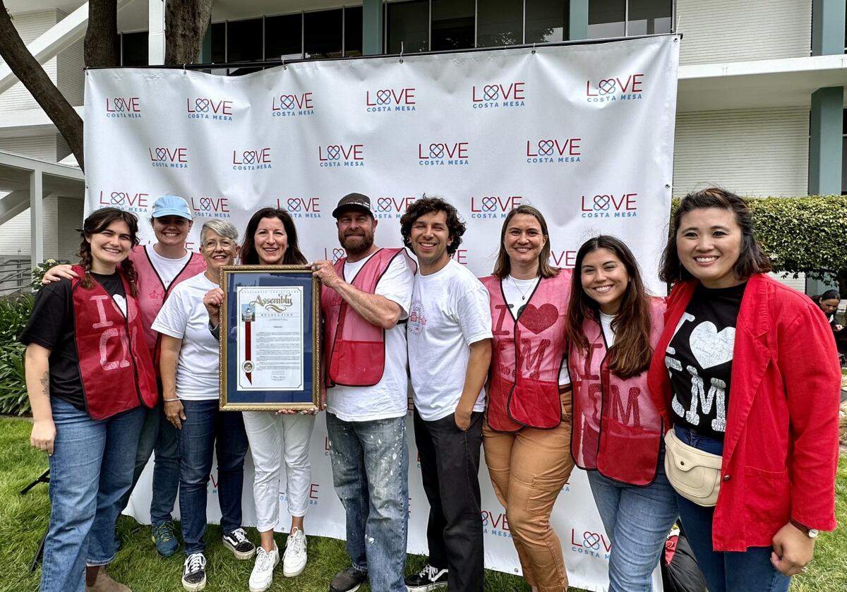 Assemblywoman Cottie Petrie-Norris, fourth from left, poses for a picture with members of Trellis on Love Costa Mesa Day.