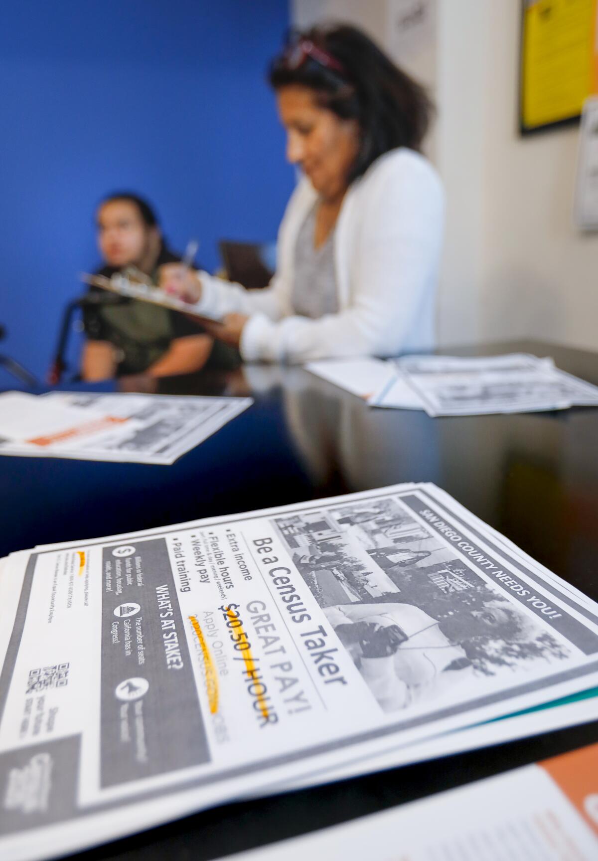 Patricia Bird and son Joel attend a recruiting session for census takers in San Diego.