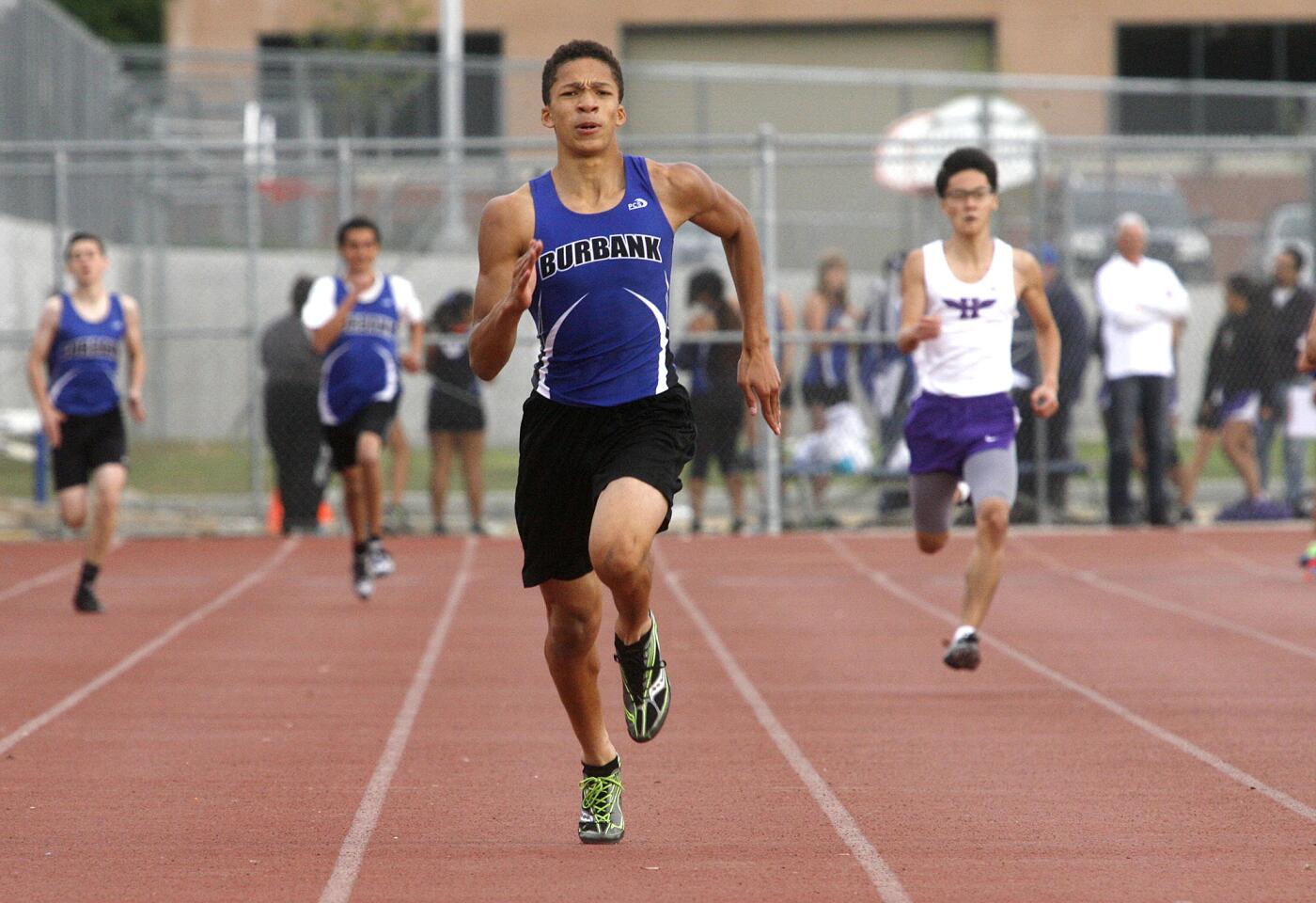 Burbank freshman Josh Cantong, 14, runs away from the field in the 400-meter with a time of 51:06 against Hoover in a Pacific League dual track and field meet at Burbank High School on Thursday, March 7, 2013.