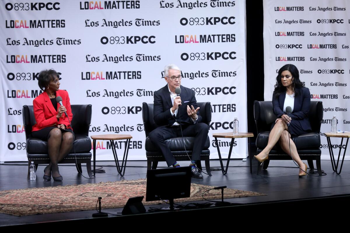 Los Angeles Dist. Atty. Jackie Lacey, left, and challengers former San Francisco D.A. George Gascón and former public defender Rachel Rossi attend a debate at the Aratani Theatre at the Japanese American Cultural & Community Center in Los Angeles on Jan. 29.