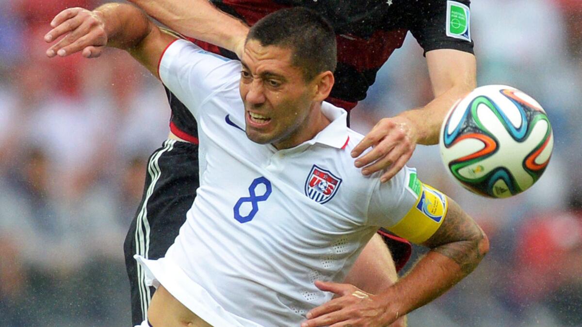 U.S. forward Clint Dempsey battles for the ball during a 1-0 World Cup loss to Germany on Thursday. Dempsey will need to be aggressive and stay healthy if the U.S. wants to defeat Belgium on Tuesday.