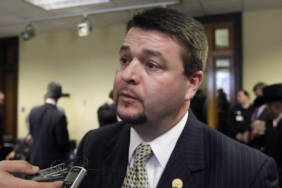 GOP Arkansas state Sen. Jason Rapert authored the nation's strictest antiabortion law, approved Wednesday after the legislature overrode a vote by the state's Democratic governor.
