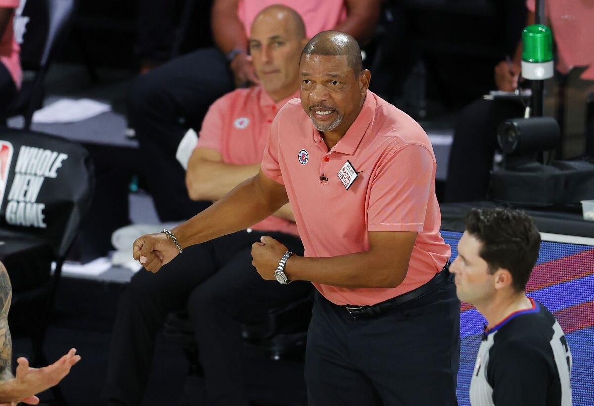 Los Angeles Clippers coach Doc Rivers argues a call during the team's NBA basketball game against the New Orleans Pelicans on Saturday, Aug. 1, 2020, in Lake Buena Vista, Fla. (Kevin C. Cox/Pool Photo via AP)