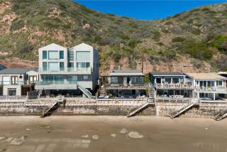 The cozy cottage spans 1,250 square feet and descends to 42 feet of frontage on Las Flores Beach.