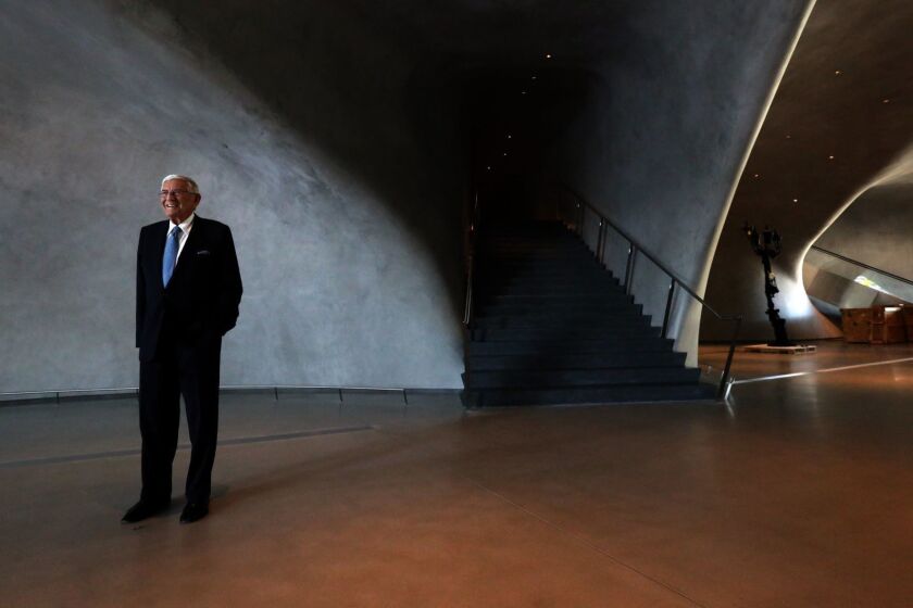 LOS ANGELES, CA - AUGUST 17, 2015 -- Eli Broad stands inside The Broad, a new contemporary art museum on Grand Avenue in Los Angeles on August 17, 2015. The museum is named for the philanthropist who is financing the $140 million building which will house the Eli and Edythe Broad contemporary art collection. The Broad museum will open Sept. 20, and as promised, admission will be free. Jasper Johns, Robert Rauschenberg, Andy Warhol, Cy Twombly, Roy Lichtenstein, Ed Ruscha, Jean-Michel Basquiat, Keith Haring, Cindy Sherman, Jeff Koons and Barbara Kruger are among the featured artists. (Genaro Molina/ Los Angeles Times)