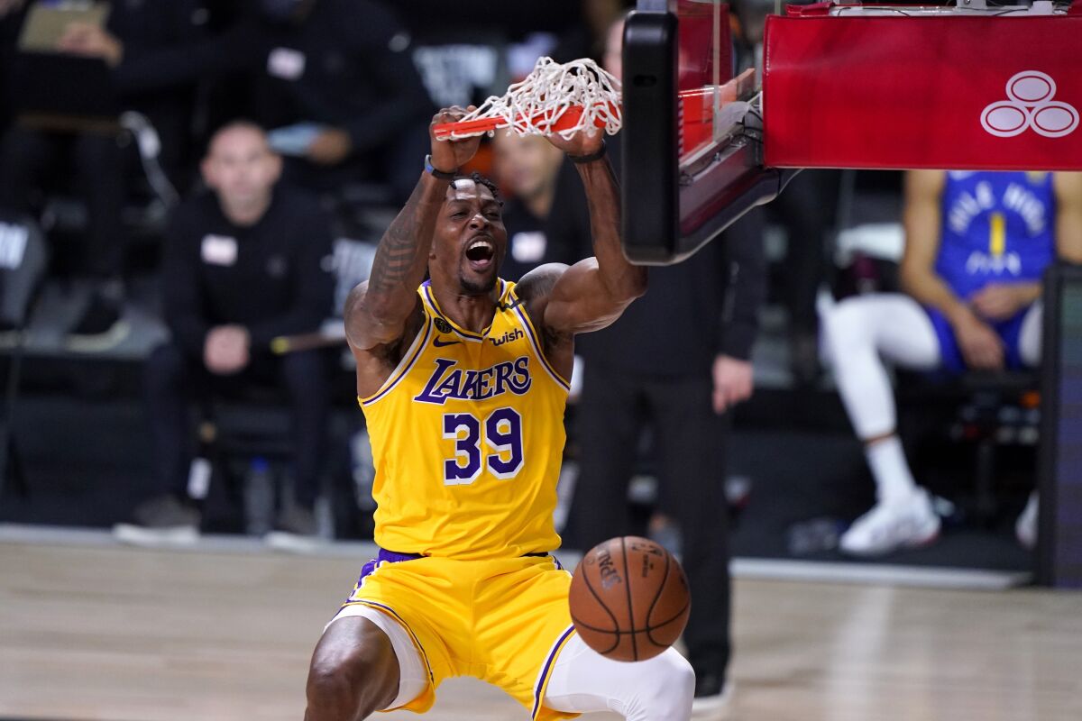 Lakers center Dwight Howard finishes off an alley-oop dunk during Game 1.