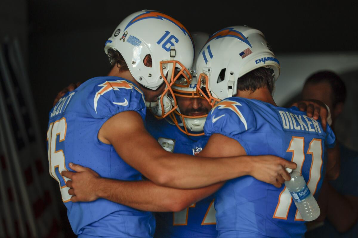 Chargers special teams players huddle before a game against the Detroit Lions on Nov. 12.