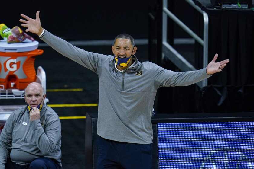 Michigan head coach Juwan Howard questions a call as his team played against Ohio State in the second half of an NCAA college basketball game at the Big Ten Conference tournament in Indianapolis, Saturday, March 13, 2021. (AP Photo/Michael Conroy)