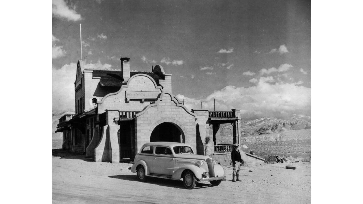 Feb. 1937: A Chevrolet touring sedan in front of the former railroad station in the ghost town of Rhyolite, Nev., later to be occupied by the Rev. Herchel Heisler and his wife, Frederica.
