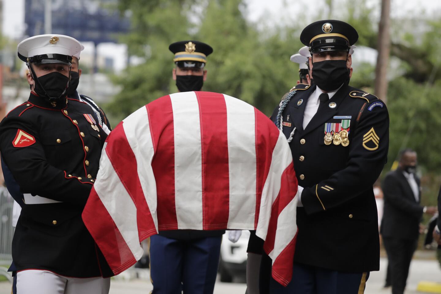 A military honor guard moved the casket of Rep. John Lewis