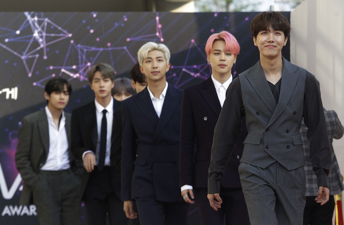 A group of men lined up diagonally