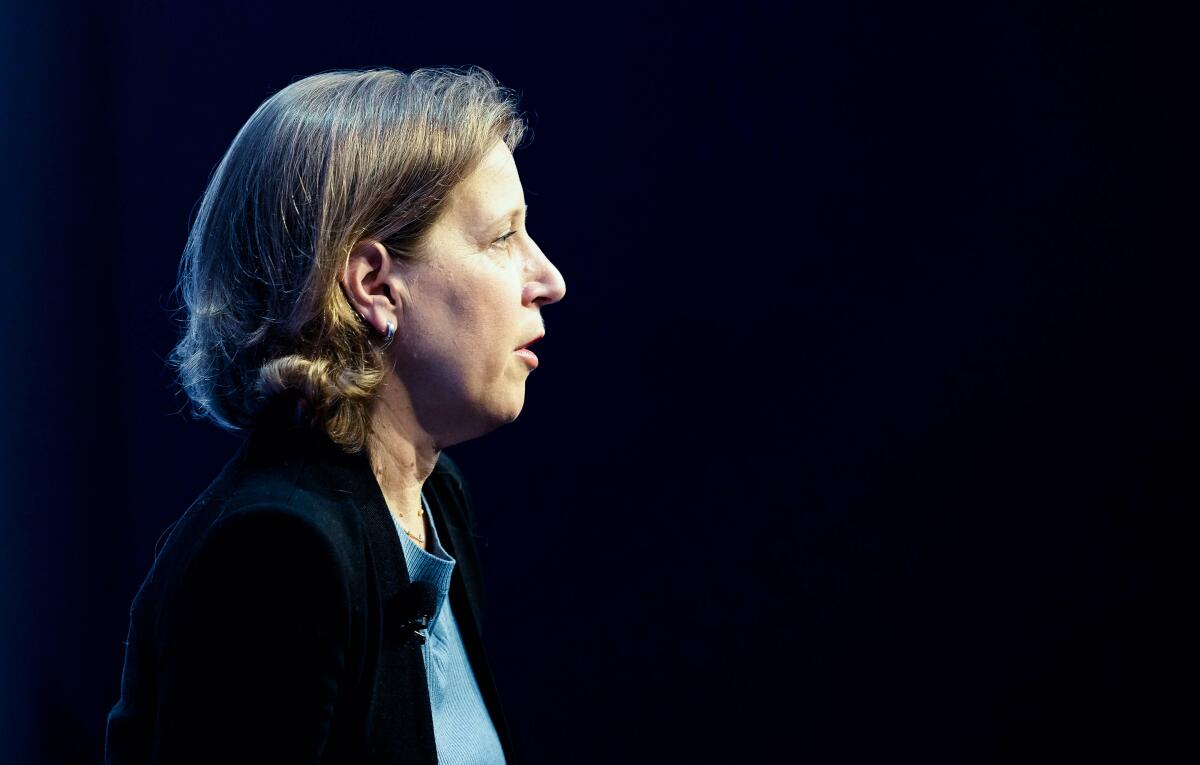 Susan Wojcicki speaks while shown in side view against a black background.